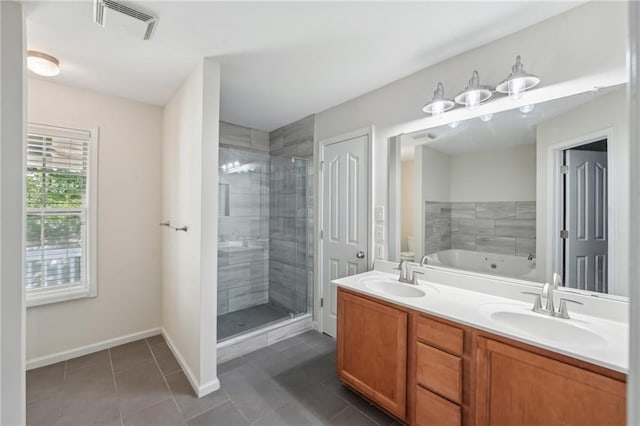 full bath featuring visible vents, a shower stall, a sink, and tile patterned flooring