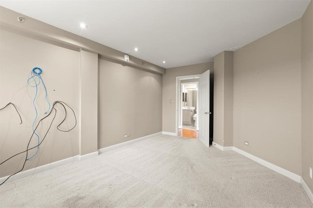 unfurnished room featuring recessed lighting, baseboards, and light colored carpet