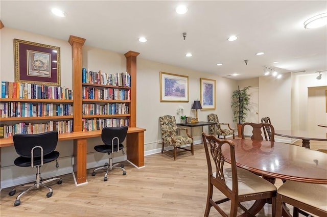 dining room featuring baseboards, track lighting, recessed lighting, and light wood-style floors