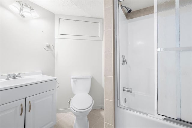 full bathroom featuring vanity, toilet, tile patterned floors, enclosed tub / shower combo, and a textured ceiling
