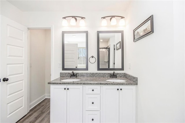 bathroom featuring hardwood / wood-style flooring and vanity