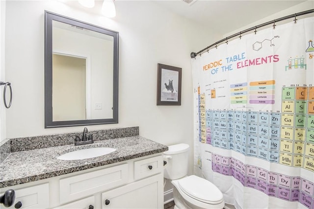 bathroom featuring vanity and toilet