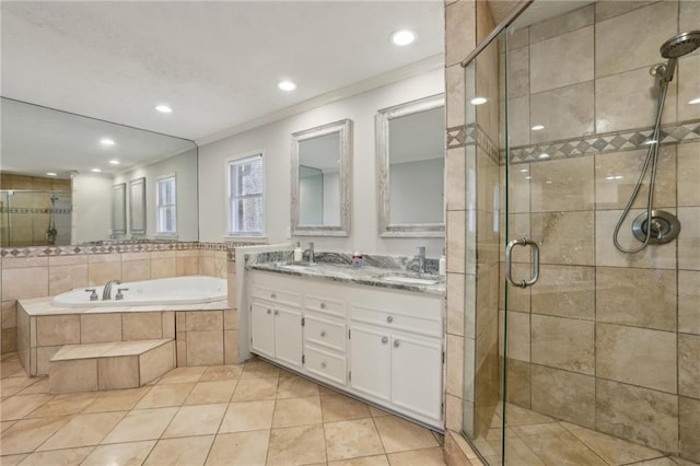 full bath featuring a garden tub, crown molding, double vanity, a stall shower, and tile patterned floors