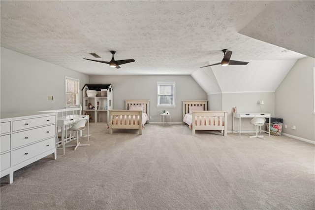 unfurnished bedroom with visible vents, baseboards, lofted ceiling, a textured ceiling, and carpet flooring