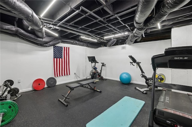 exercise room with baseboards