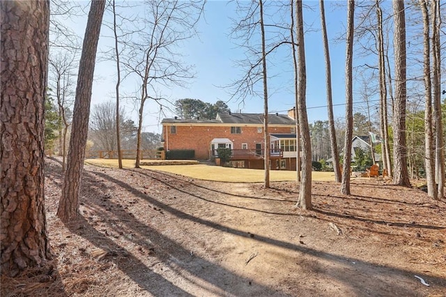 back of house with brick siding