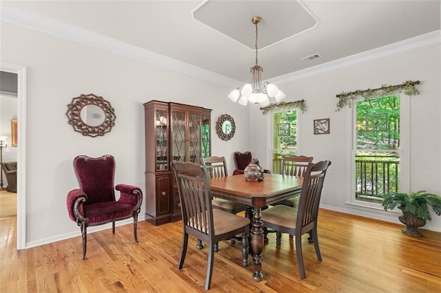 144 Canacaught Pl, Jasper, GA 30143 - dining space featuring a chandelier, light wood finished floors, ornamental molding, and baseboards