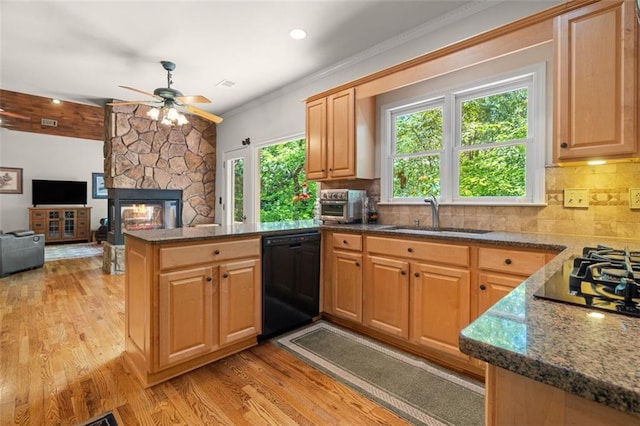 144 Canacaught Pl, Jasper, GA 30143 - kitchen with black appliances, a sink, a peninsula, ceiling fan, and a stone fireplace