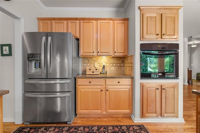 144 Canacaught Pl, Jasper, GA 30143 - kitchen with stainless steel fridge, oven, light wood-style floors, dark stone countertops, and decorative backsplash