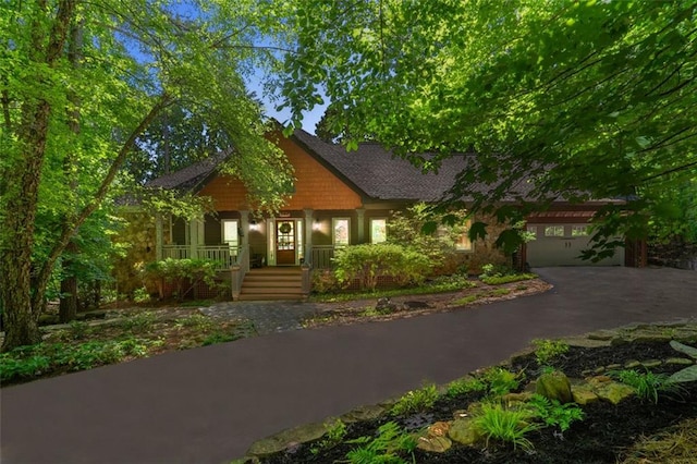 144 Canacaught Pl, Jasper, GA 30143 - view of front facade featuring asphalt driveway, a garage, and a porch