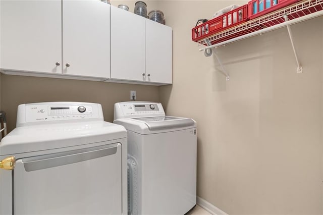 144 Canacaught Pl, Jasper, GA 30143 - laundry area with cabinet space, washer and clothes dryer, and baseboards
