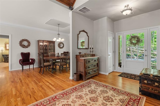 144 Canacaught Pl, Jasper, GA 30143 - foyer entrance featuring light wood-style floors, a chandelier, baseboards, and ornamental molding