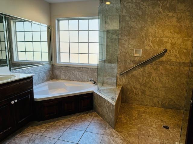 bathroom featuring tile patterned floors, vanity, and separate shower and tub