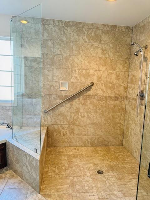 bathroom featuring plus walk in shower and tile patterned floors