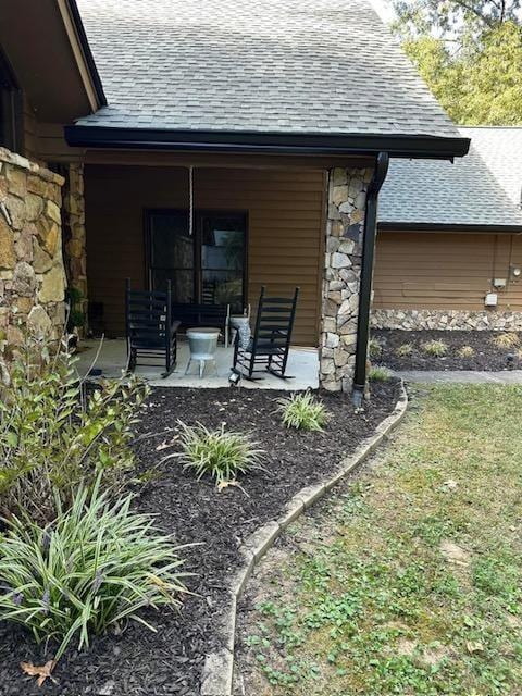 rear view of house with a porch