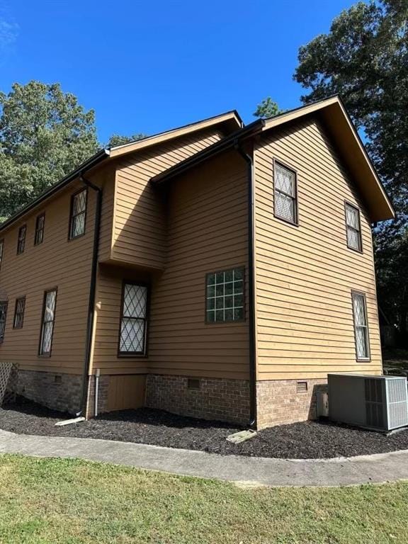 view of property exterior with central AC