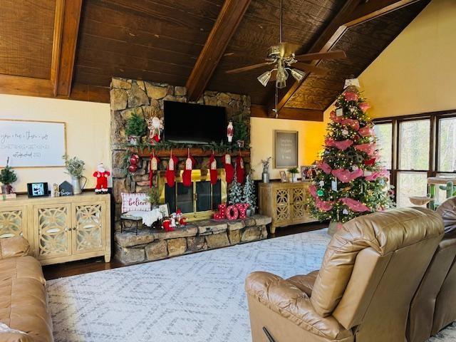 living room featuring ceiling fan, beam ceiling, wood ceiling, and high vaulted ceiling