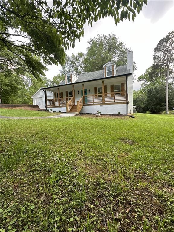 306 Northview Dr, Commerce, GA 30529 - view of front of house with covered porch, a chimney, a front yard, and a garage