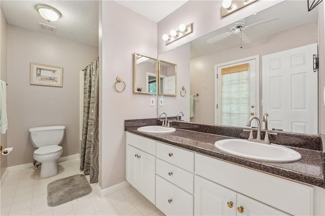 6960 Worley Rd, Cumming, GA 30028 - full bath featuring a ceiling fan, toilet, double vanity, baseboards, and tile patterned floors