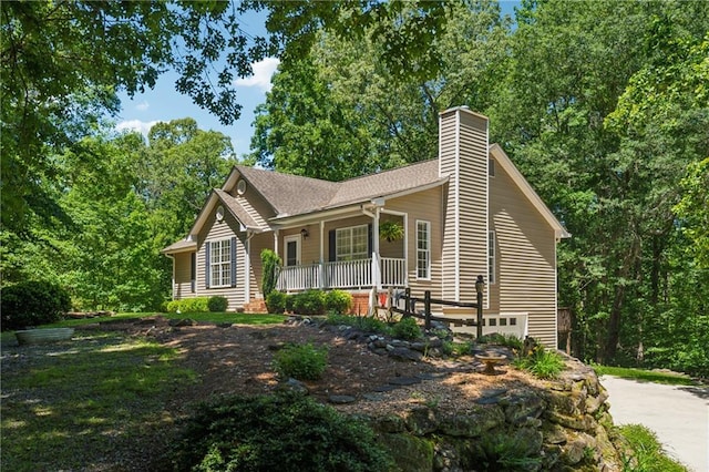 6960 Worley Rd, Cumming, GA 30028 - single story home with a porch, a chimney, driveway, and a garage