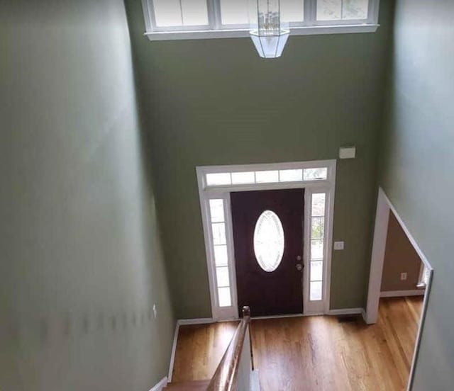 entryway featuring light wood-type flooring and baseboards