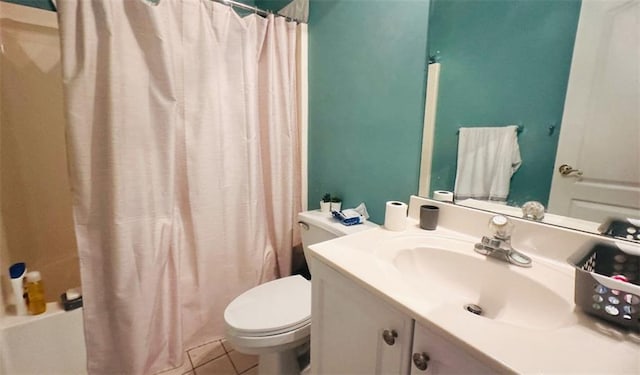 bathroom featuring vanity, shower / bath combo, tile patterned flooring, and toilet