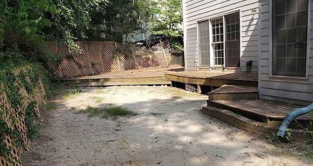 view of yard featuring a wooden deck