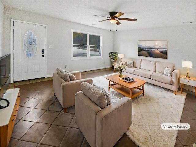 tiled living room with ceiling fan