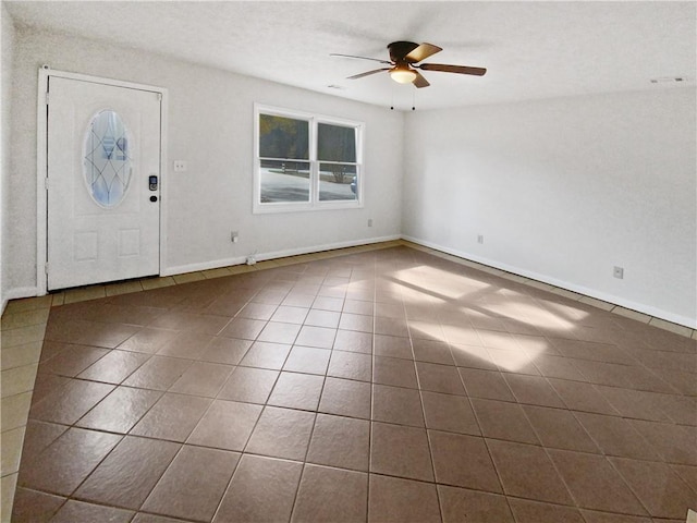 foyer entrance featuring tile patterned floors and ceiling fan