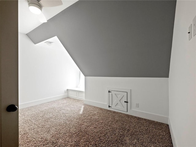 bonus room with carpet, visible vents, baseboards, and vaulted ceiling