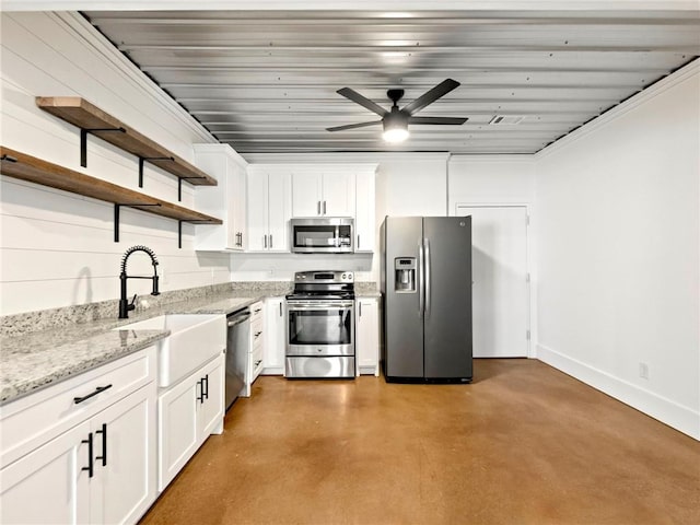 kitchen with white cabinets, stainless steel appliances, concrete flooring, open shelves, and a sink