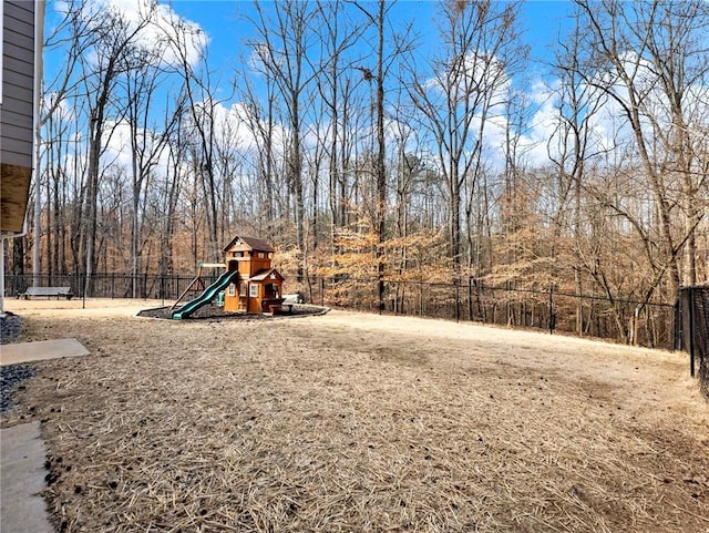 view of jungle gym featuring fence