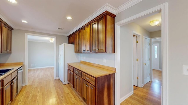 kitchen featuring stainless steel dishwasher, light countertops, light wood-style floors, and freestanding refrigerator