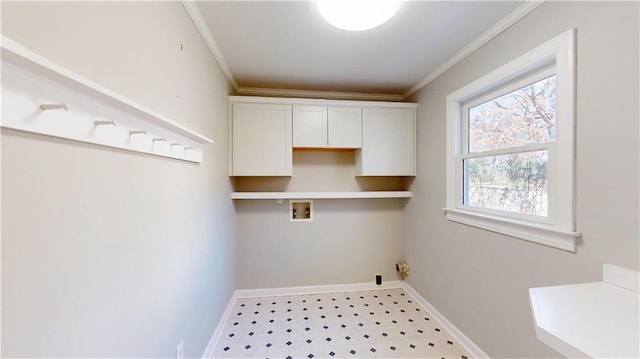 washroom featuring baseboards, washer hookup, and crown molding