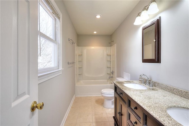 bathroom with tile patterned floors, toilet, baseboards, and a sink