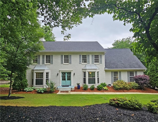 1885 Dayron Trce, Marietta, GA 30062 - colonial home with a front yard, brick siding, a chimney, and roof with shingles
