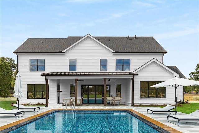 back of property featuring a patio area and ceiling fan