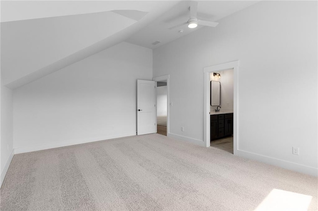 bonus room with light colored carpet, vaulted ceiling, ceiling fan, and sink