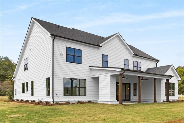 view of front of home with a front lawn, a patio, and ceiling fan