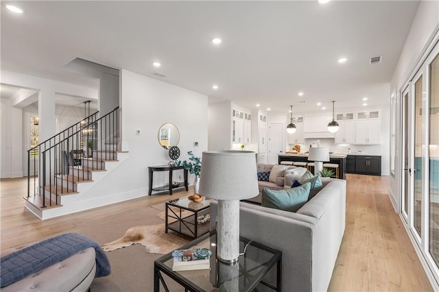 living room with light hardwood / wood-style flooring