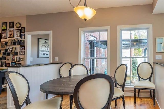 dining area with light wood finished floors