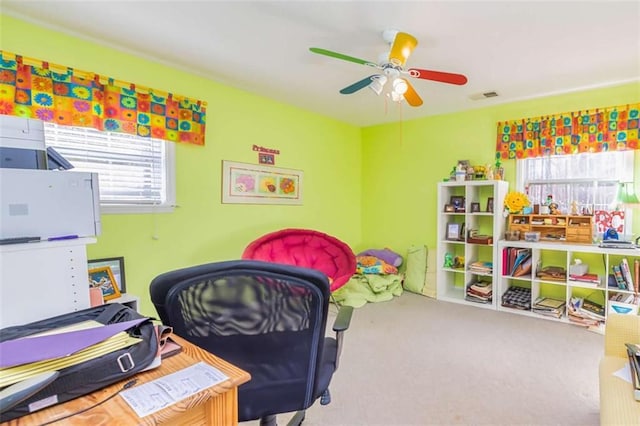 playroom featuring carpet floors, ceiling fan, and visible vents