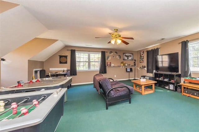 living area featuring lofted ceiling, carpet floors, and plenty of natural light