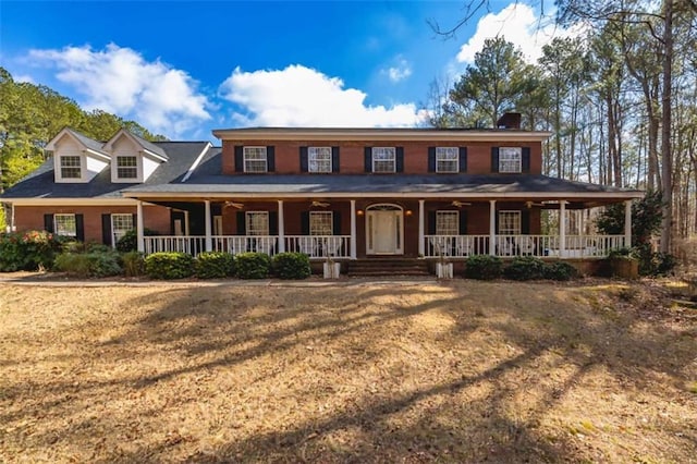 view of front of home with a front lawn and a porch