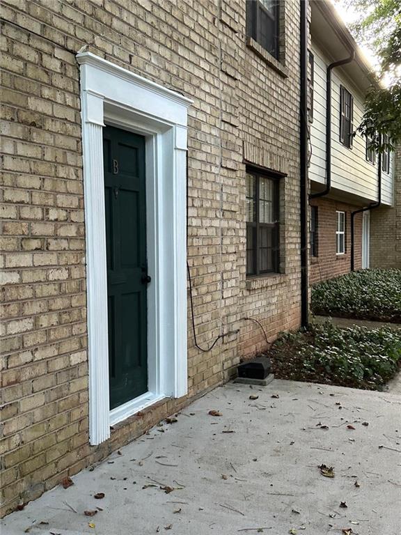 doorway to property with a patio