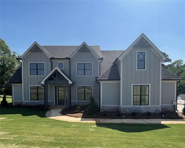 1210 Askew Trl, Greensboro, GA 30642 - view of front of home featuring stone siding, board and batten siding, and a front yard