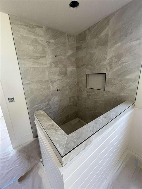 1210 Askew Trl, Greensboro, GA 30642 - full bathroom featuring tile walls, marble finish floor, and a tile shower
