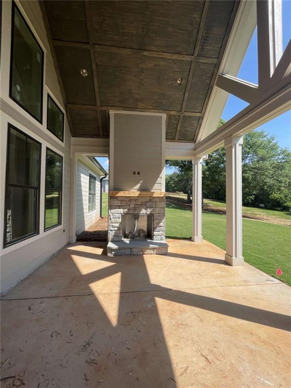 1210 Askew Trl, Greensboro, GA 30642 - view of patio / terrace with an outdoor stone fireplace