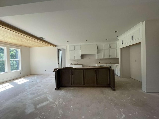 1210 Askew Trl, Greensboro, GA 30642 - kitchen featuring white cabinetry, unfinished concrete floors, and a center island