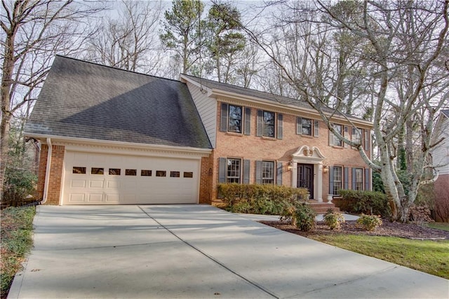 colonial inspired home with a garage